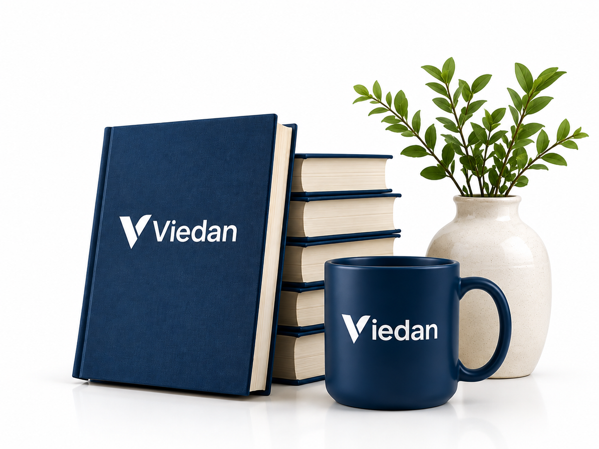 Viedan books, mug, plant and maple leaf